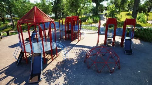 Colorful Outdoor Playground with Slides and Climbing Structures in a Sunny Park