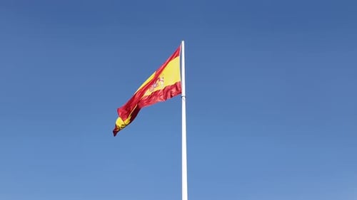 Flag Waving against Blue Sky