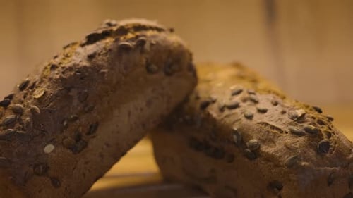 Crusty Rye Bread with Seeds on Wooden Surface
