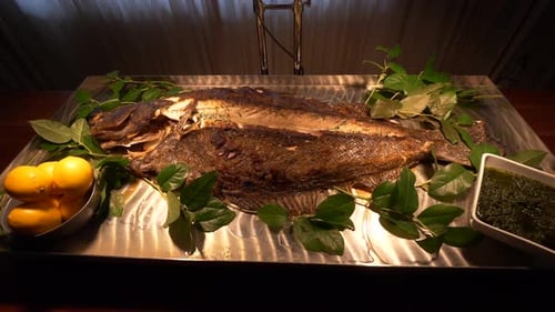 Grilled Whole Fish with Lemons and Green Sauce