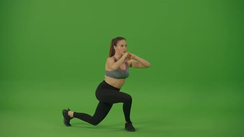 Woman Strong and Fit in an Athletic Top is Doing Squat Exercises Green Screen