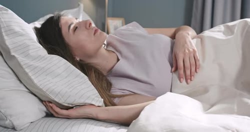 Calm Young Woman Sleeping Well in Comfortable Cozy Bed on Soft Pillow Caucasian Female Resting