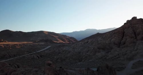 Aerial Sunrise Landscape View and Desert Road in Valley of Alabama Hills, California USA