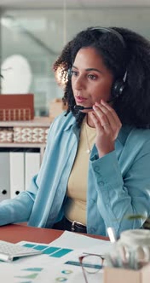 Woman, headset and phone call with paperwork graphs, typing for data entry