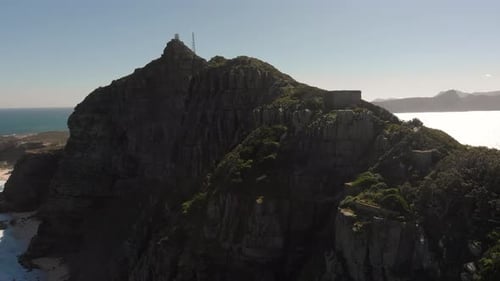 Wide Aerial Rising View of Huge Cliffs Next the the Beaches of Cape Point in South Africa