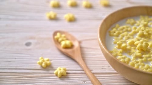 Crunchy Cereal with Milk in Wooden Bowl