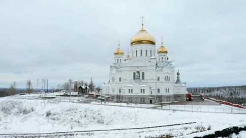 Big white church and forest on the background