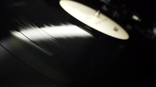 Segments of Vinyl Record Spinning Macro View Playing Musicsong From Turntable Retrostyled Player