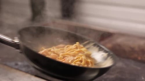 Pasta Cooking in Frying Pan Close Up
