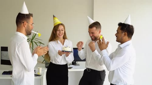 Business Team Celebrating a Birthday of Collegue in the Modern Office