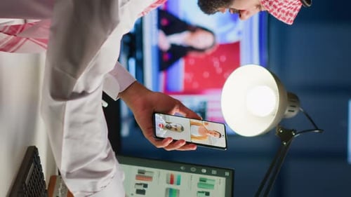 Man in Headscarf in Remote Meeting at Desk