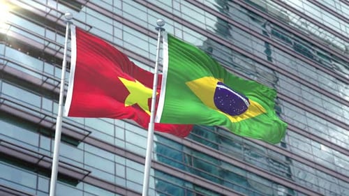 Vietnam and Brazil National Flags Waving on Modern Corporate Building