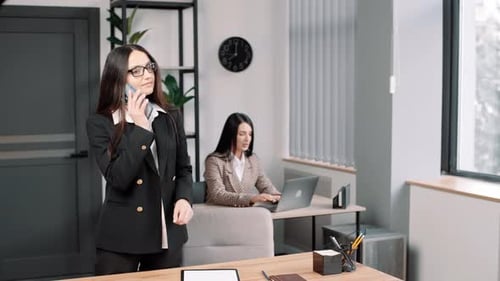 Professional Women Working Together in Modern Office