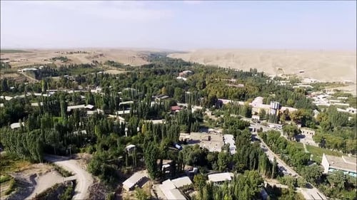 houses in the middle of the mountain drone frame