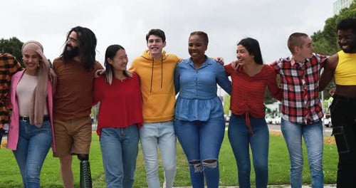Diverse young people laughing and enjoying a summer party together in South Africa