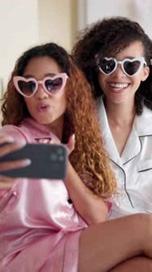 Young Women Taking Selfie in Pajamas