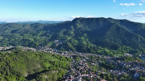 View From Rock to Town of Smolyan with Meadows for Cattle Walking and Houses Between Mountain Range