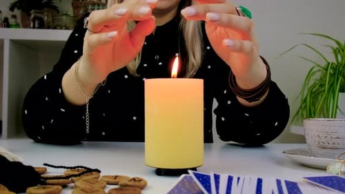 Woman with Tarot Cards and Candlelight