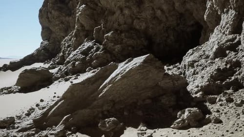 Massive Rock Formation Along Mountain Cliff