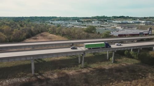 Truck driving on highway bridge