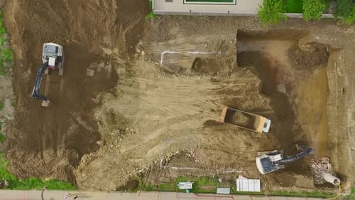 Aerial View of Construction Site with Heavy Machinery
