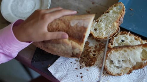 Slicing Fresh Bread at Home