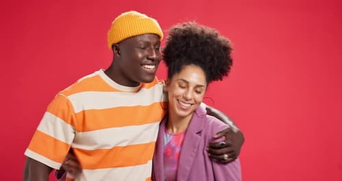 Happy, hug and face of couple in studio with gesture for bonding, commitment and relationship