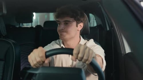 Man with Curly Hair Sitting in Car