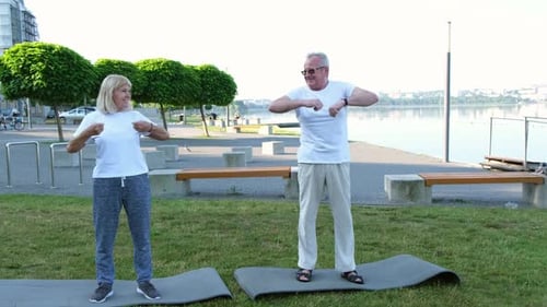 Active Senior Couple Exercising Outdoors Together