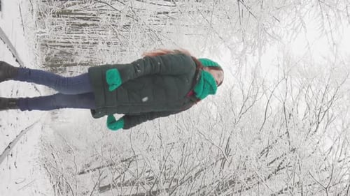 Vertical Video A Walk Through the Winter Forest Becomes a Real Journey for This Young Woman She