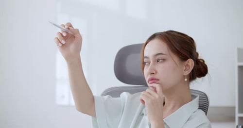 Businesswoman Brainstorming and Visualizing Success with Creative Gestures