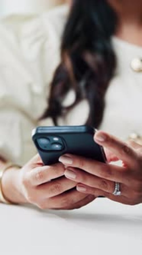 Woman, hands and typing in creative agency with phone, online and post for social media marketing