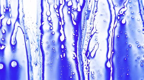 Abstract Liquid Dripping Down Blue Surface