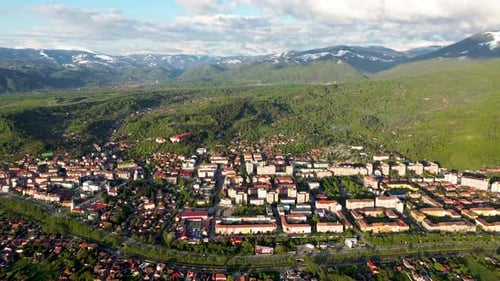 4k cinematic aerial drone footage featuring a beautiful city in the big carpathians with the mountai
