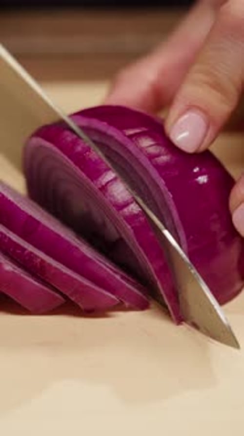 Close up of a red onion being sliced