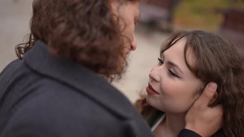 Affectionate Couple Gazing at Each Other in Park