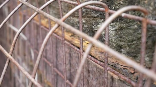 Rusty Wire Fence and Weathered Wood Texture