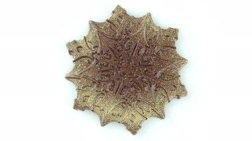 Rotating Magic Snowflake Made Of Chocolate.