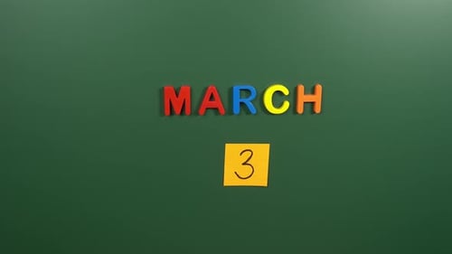 Hand sticking a sticker 3 March calendar day on school board. 3 date of March. Third day March