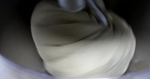 Mixing Machine Blends Creamy Dough in Stainless Bowl