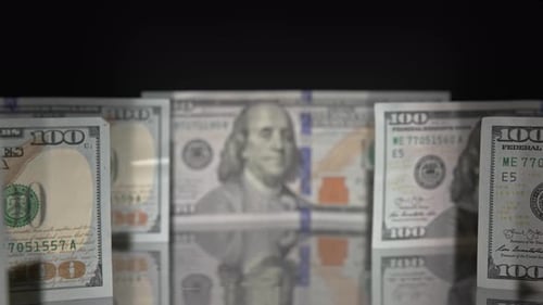 Zooming in on Stack of Hundred Dollar Bills