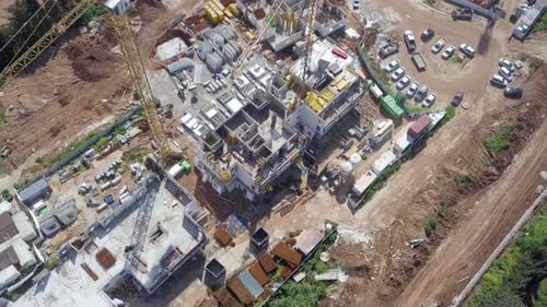 Large residential construction site with cranes, Aerial view