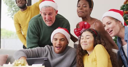 Friends and Family Celebrate Christmas Together Indoors