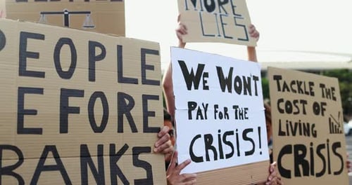 Diverse Group Protests Holding Signs Outdoors