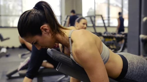 Young Women in Gym Working Out with Various Barbells Active