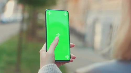 Beautiful Woman Using Chroma Key Smartphone Outside City Street