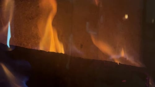 Burning Logs in Modern Fireplace with Warm Flames