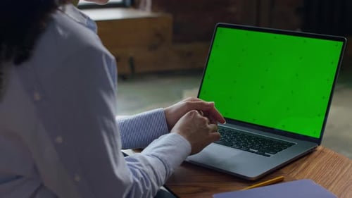 Laptop With Green Screen at Home Workspace