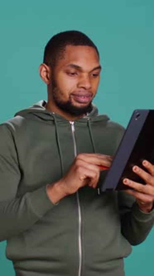 Vertical Video Man Adding Payment Method on Website Using Laptop