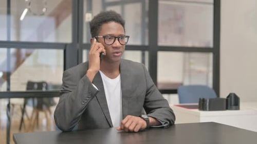 African American Man Talking on phone in Office